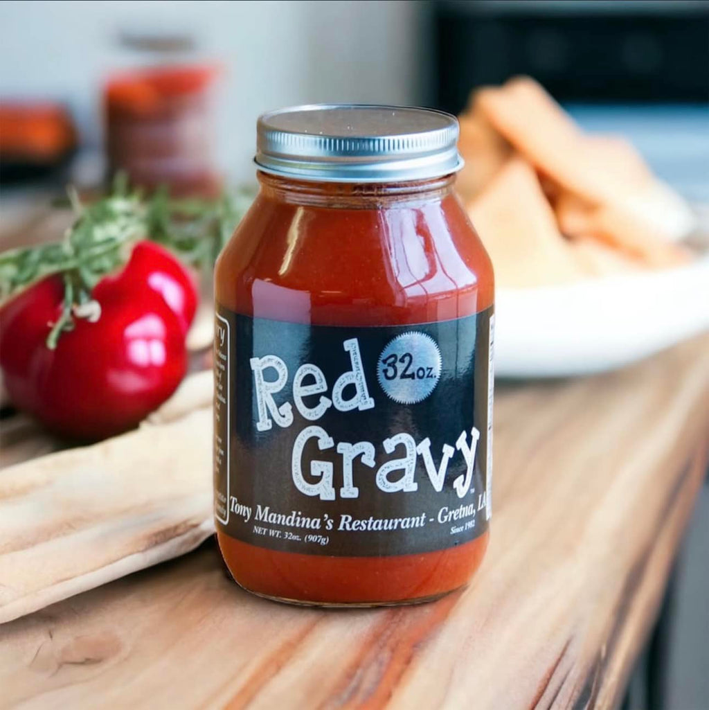 Jar of Tony Mandina's Red Gravy with a label on a wooden surface